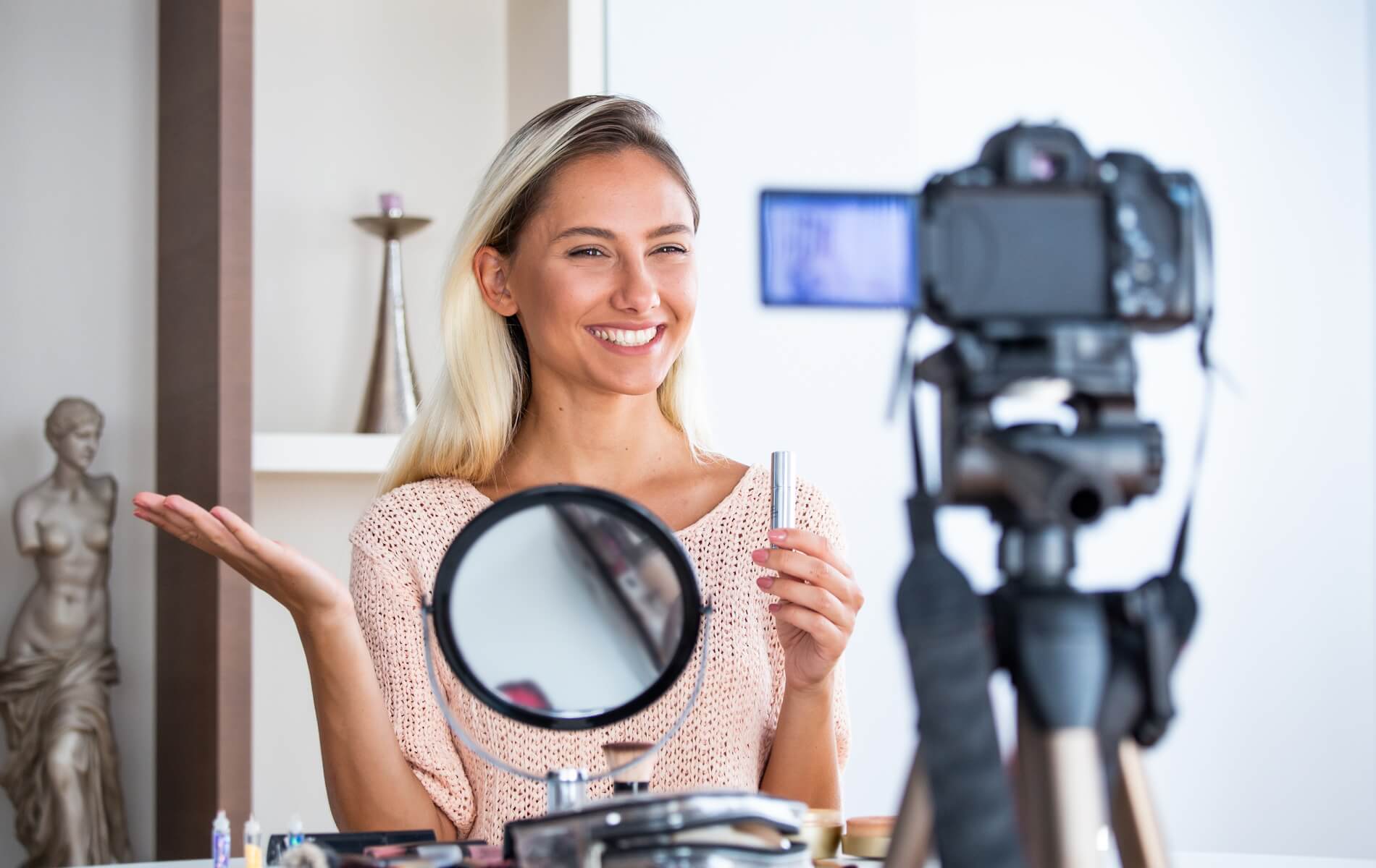 An influencer recording a make-up video