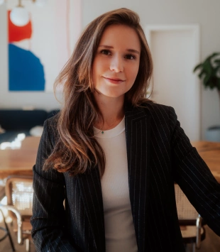 Sarah Emmerich, Social Media Expert, posing in her office