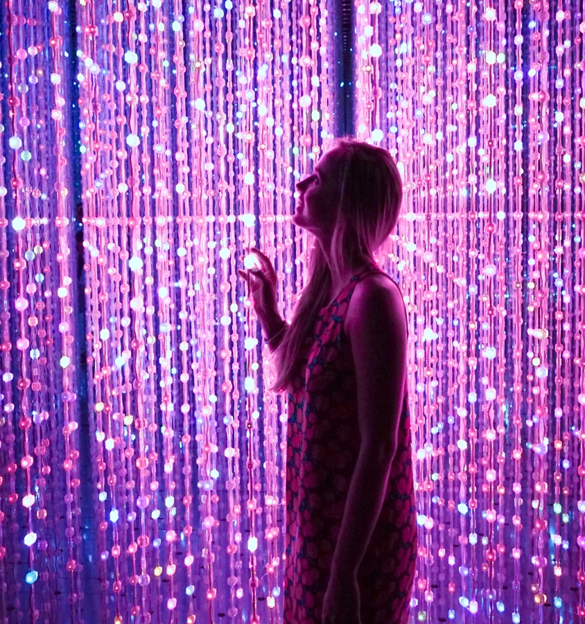 woman in front a lightening screeen